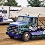 Mike Gibbons (12) leads Weston Smith in a Rolling Thunder Big Rigs race on Saturday at Grays Harbor Raceway in Elma. (Photo by AR Racing Videos)