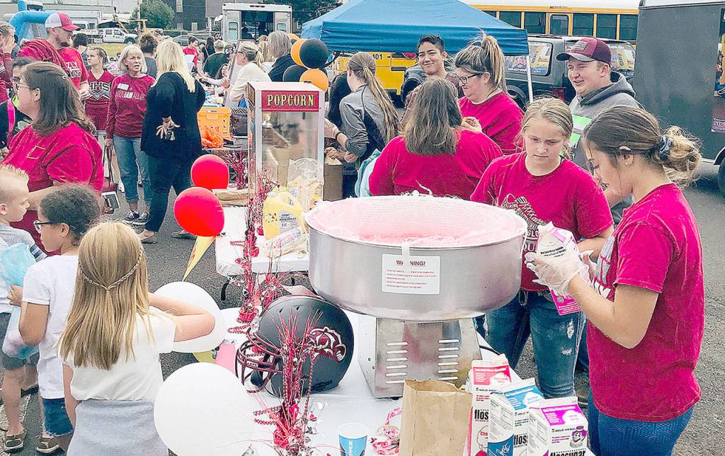 COURTESY PHOTO                                Students marching from Hoquiam Middle School to Central Elementary during Mondays back-to-school kickoff and community day event found plenty of food at the end, including treats like cotton candy and popcorn.