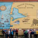 Courtesy Robert Esposito                                Staff and administrators from the Port of Grays Harbor, the City of Aberdeen and Our Aberdeen stand next to a new mural in Aberdeen that was dedicated Tuesday to the late Port Commissioner Jack Thompson. The mural was designed and painted by Jenny Fisher.