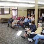 Michael Lang | Grays Harbor News Group                                 Sarah Ogden (left), district manager for innovation and user experience at Timberland Regional Library, calls on a member of the audience during a public meeting Wednesday at the branch in Hoquiam.