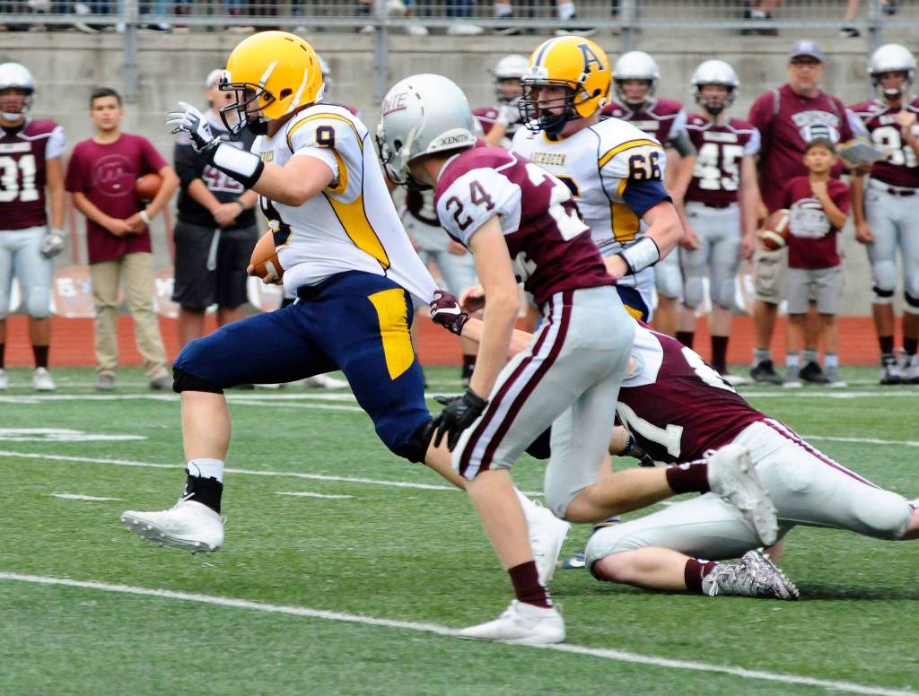 Aberdeens Elijah Brown breaks a tackle on a QB run against Montesano at the Jamboree in Montesano on Friday. (Hasani Grayson | Grays Harbor News Group)