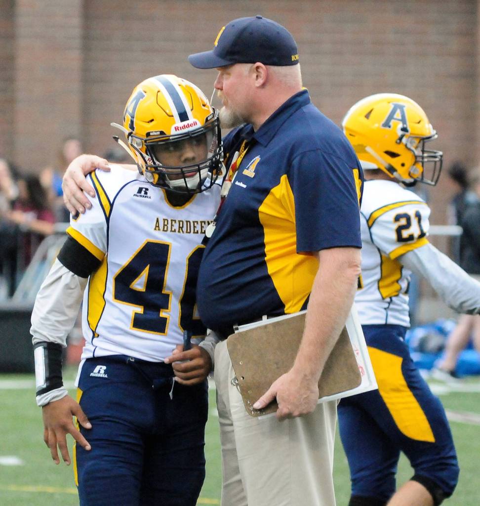 Aberdeen head coach Todd Bridge gives some pointers to Jose Mercado-Morales after a defensive drive at the Jamboree on Friday. (Hasani Grayson | Grays Harbor News Group)