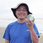 COURTESY JEFF AND MARIANNE PENCE                                Kentaro Urata of Kirkland found this hand-blown glass Japanese fishing float near Westport. Westport South Beach Historical Society members Jeff and Marianne Pence saw him with the float and snapped the picture.