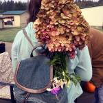 A workshop visitor heads home with a peegee hydrangea blossom from last years Seed Saver event.