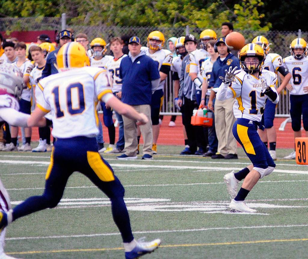 Aberdeen running back Connar Sherman catches a pass in the flat from quarterback Cody Bemis in the first quarter of a game against on Friday at Jack Rottle Field in Montesano. (Hasani Grayson | Grays Harbor News Group)