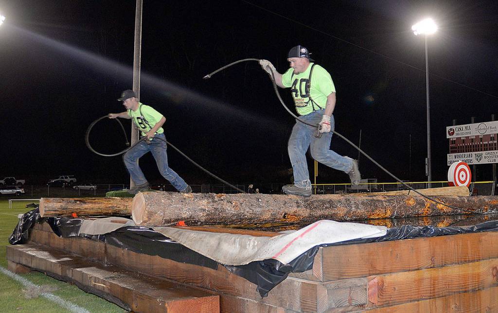 DAN HAMMOCK | GRAYS HARBOR NEWS GROUP                                Cody Sterns, right, and Brady Cummings cross the pond during the Local Choker competition.