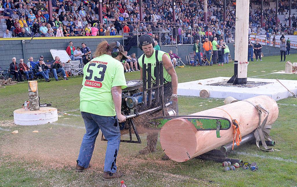 DAN HAMMOCK | GRAYS HARBOR NEWS GROUP                                Natalie Amber and Johnny Boggs bring the noise with a hot saw at Hoquiam Loggers Playday at Olympic Stadium Saturday.