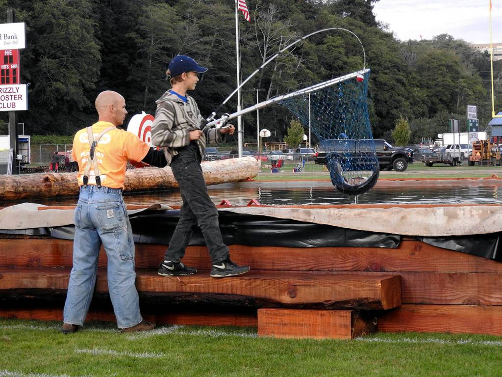 Randy J. Houk, 11, hooked a 12-pound steelhead with some help from Hoki Moir, the subject of this years Playday dedication.