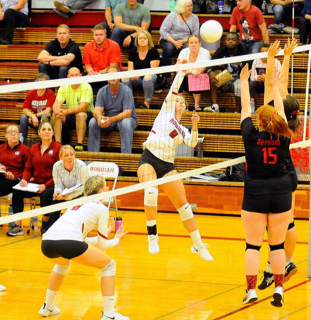 Hoquiams Kamryn Krohn, middle, goes for a kill in the second set of a home game against Raymond on Tuesday. (Hasani Grayson | Grays Harbor News Group)