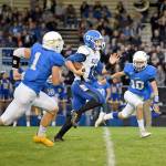 Elma senior Cody Vollan, middle, takes off for a 62-yard touchdown run against Rochester on Friday at Rochester High School. (Photo by Sue Michalak Budsberg)