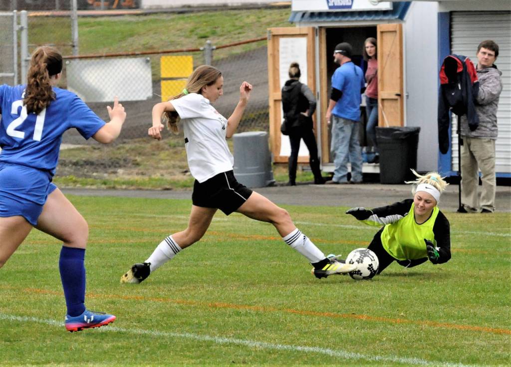 Elma keeper Paige Knutson makes a save on a close-range shot from Shetons Victoria Silverman in the first half of game on Saturday afternoon at Davis Field in Elma. (Hasani Grayson | Grays Harbor News Group)