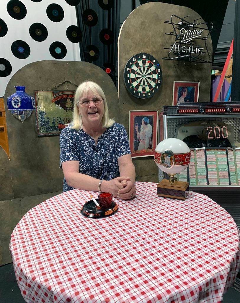 Kat Bryant | Grays Harbor News Group                                Driftwood board president Terry Rogers takes a seat on the set of Always … Patsy Cline, which opens the theaters new season Saturday. I am always amazed with my Driftwood family, she says. We support each other, and the community supports us.