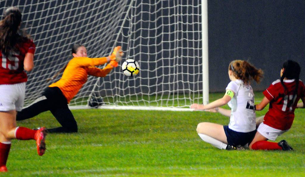 Hoquiam keeper Katie Burnett makes a save on a shot from Aberdeens Emmy Walsh in the second half of a match on Tuesday at Olympic Stadium in Hoquiam. (Hasani Grayson | Grays Harbor News Group)