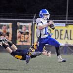 Aberdeens Seth Brown, left, chases down Elma quarterback Cody Vollan in the first half of Fridays game at Stewart Field. (Ryan Sparks | Grays Harbor News Group)
