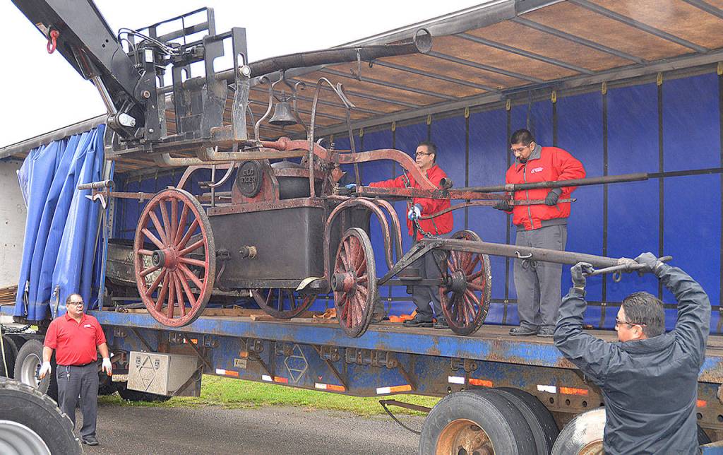 Photos by DAN HAMMOCK | GRAYS HARBOR NEWS GROUP                                An 1855 hand pumper from the Aberdeen Museum of History was moved from storage in Kent to a new storage unit on Port Industrial Road Monday.