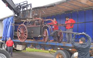Photos by DAN HAMMOCK | GRAYS HARBOR NEWS GROUP                                An 1855 hand pumper from the Aberdeen Museum of History was moved from storage in Kent to a new storage unit on Port Industrial Road Monday.