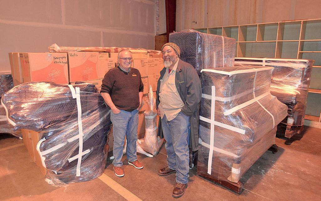 Dann Sears, left, archivist of the Aberdeen Museum of History, and museum Director Dave Morris stand in front of the first load of exhibits to return from storage in Kent to a new space on Port Industrial Road.