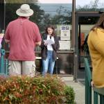 Madison Hopkins (center), a junior at Montesano High School, reads a list of climate demands to the crowd Friday, Sept. 20, in front of the county administration building in Montesano as part of a global climate strike. (Michael Lang | Grays Harbor News Group)