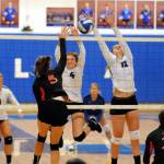 Elmas Hannah Warren (4) and Jalyn Sackrider block the shot of Centralias Madelinn Corwin (5) during the Eagles 3-1 win over the Tigers on Monday at Elma High School.(Ryan Sparks | Grays Harbor News Group)