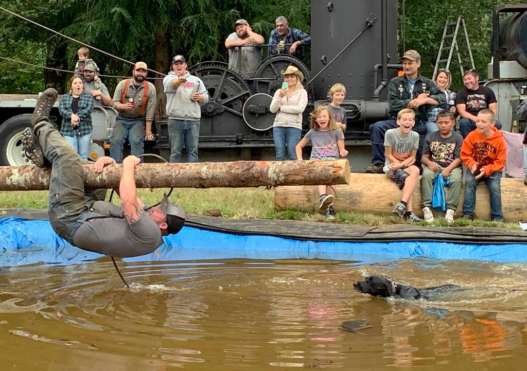 Cody Stearns lost his balance during the obstacle choker event, but hung on and made it back to land dry. He finished with a fourth-place time of 39 seconds (followed closely by a dog that jumped in to help).