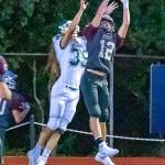 Montesanos Sam Winter (12) intercepts a pass against Port Angeles recevier Derek Bowechop during the Bulldogs 70-12 rout of the Roughriders on Friday at Jack Rottle Field in Montesano. (Hasani Grayson | Grays Harbor News Group)