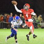Elma linebacker Isaiah OFarrill, left, chases Castle Rock quarterback Chance Naugle during Fridays game in Castle Rock. (Photo by Sue Michalak Budsberg)