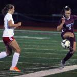 Montesanos Sierra Birdsall controls a pass near the sidelines while defended by Hoquiams Emily Daniels in the first half of a match at Jack Rottle Field in Montesano. (Hasani Grayson | Grays Harbor News Group)