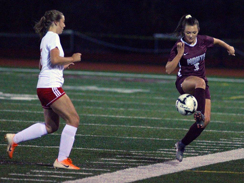 Montesanos Sierra Birdsall controls a pass near the sidelines while defended by Hoquiams Emily Daniels in the first half of a match at Jack Rottle Field in Montesano. (Hasani Grayson | Grays Harbor News Group)