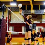 Montesanos Jessica Stanfield tips a ball over the net in the third set of a match against Hoquiam on Tuesday in Hoquiam. (Hasani Grayson | Grays Harbor News Group)