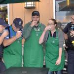 Photos by DAN HAMMOCK | GRAYS HARBOR NEWS GROUP                                The espresso shot challenge proved more challenging than the participants expected. From left are Aberdeen Police Officers Cody Blodgett and George Kelly, Aberdeen Mayor Erik Larson, and Starbucks Manager Jaclyn Meeks. Kelly downed his the fastest. At right is Police Sgt. Darrin King, who emceed the event.