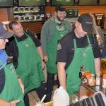 Cole Streeter, right, gave a crash course in latte-making at the Aberdeen Coffee with a Cop event. From left are Officer George Kelly, Lt. Dale Green, Aberdeen Mayor Erik Larson and Officer Gary Sexton.