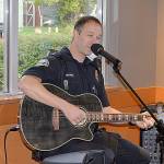 Aberdeen Police Officer Jackie Mitchell played two sets during the music by a cop portion of the Oct. 2 event at the Wishkah Street Starbucks.