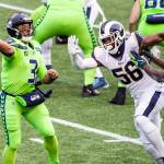 Seattle Seahawks quarterback Russell Wilson (3) throws under pressure from Los Angeles Rams defensive end Dante Fowler (56) in the first quarter at CenturyLink Field in Seattle on Thursday, Oct. 3, 2019. (Andy Bao/Seattle Times/TNS)
