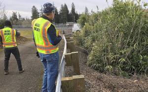 COURTESY DEPARTMENT OF ECOLOGY                                Department of Ecology dam safety inspectors survey Aberdeens Fairview Reservoir No. 1.