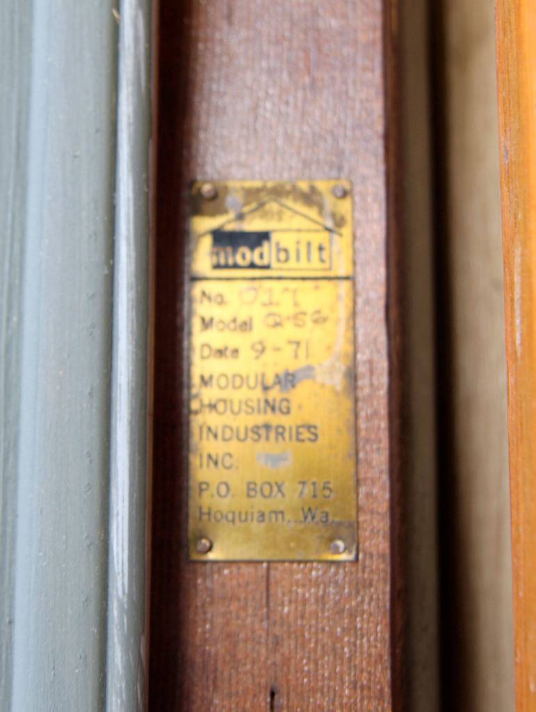 A plaque nailed into a door jamb at Cosmpopolis Police Station states the building was constructed in September 1971. Photo take Tuesday, Oct. 8, 2019. (Michael Lang | Grays Harbor News Group)