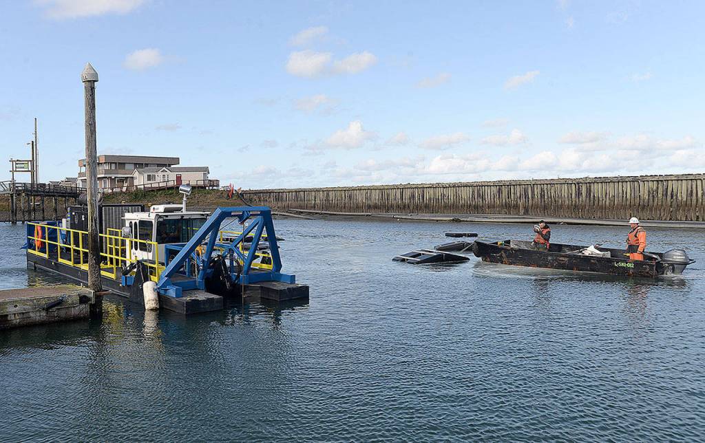 Photo by DAN HAMMOCK | GRAYS HARBOR NEWS GROUP                                The smaller of two dredges working the Westport Marina works Float 20 Oct. 8.