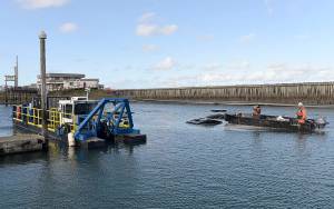 Photo by DAN HAMMOCK | GRAYS HARBOR NEWS GROUP                                The smaller of two dredges working the Westport Marina works Float 20 Oct. 8.