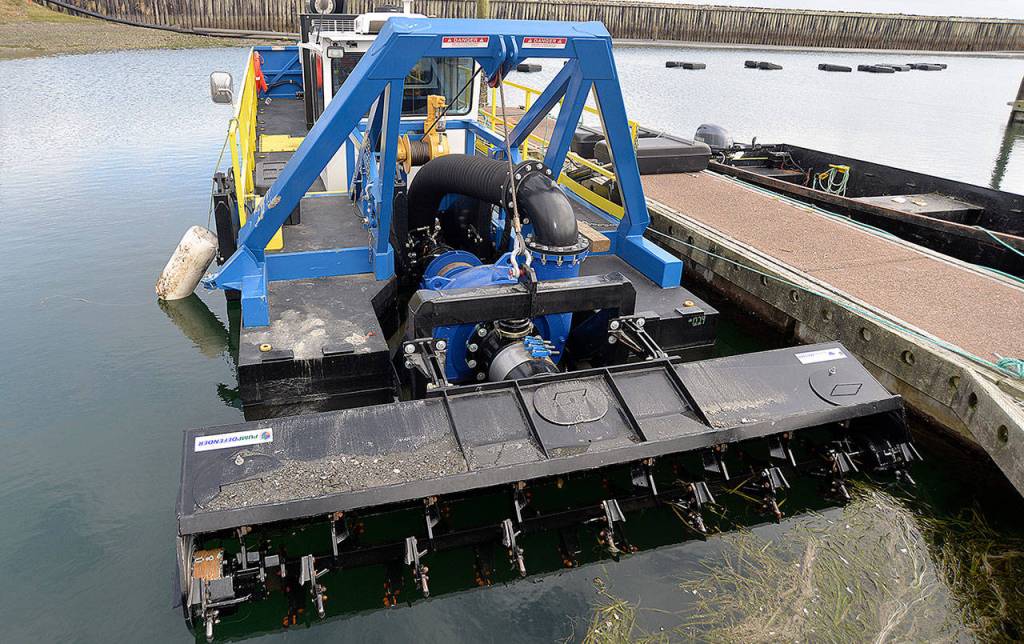 DAN HAMMOCK | GRAYS HARBOR NEWS GROUP                                One of two dredges being used to dredge the Westport Marina.
