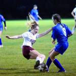 Montesanos Brooke Streeter executes a slide tackle to get the ball away from Elmas Janessa Sample in the second half of a match on Tuesday in Elma. (Hasani Grayson | Grays Harbor News Group)