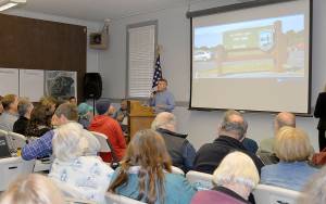 DAN HAMMOCK | GRAYS HARBOR NEWS GROUP                                Ryann Day of Westport Golf LLC talks about the groups vision for a Scottish links-style golf course at Westport Light State Park during a packed open house at McCausland Hall Tuesday.