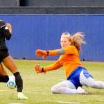 Grays Harbors Kristi Raffelson dives to make a save on Highlines Hannah Jenkins on a breakaway in the second half at Stewart Field in Aberdeen on Saturday. (Hasani Grayson | Grays Harbor News Group)