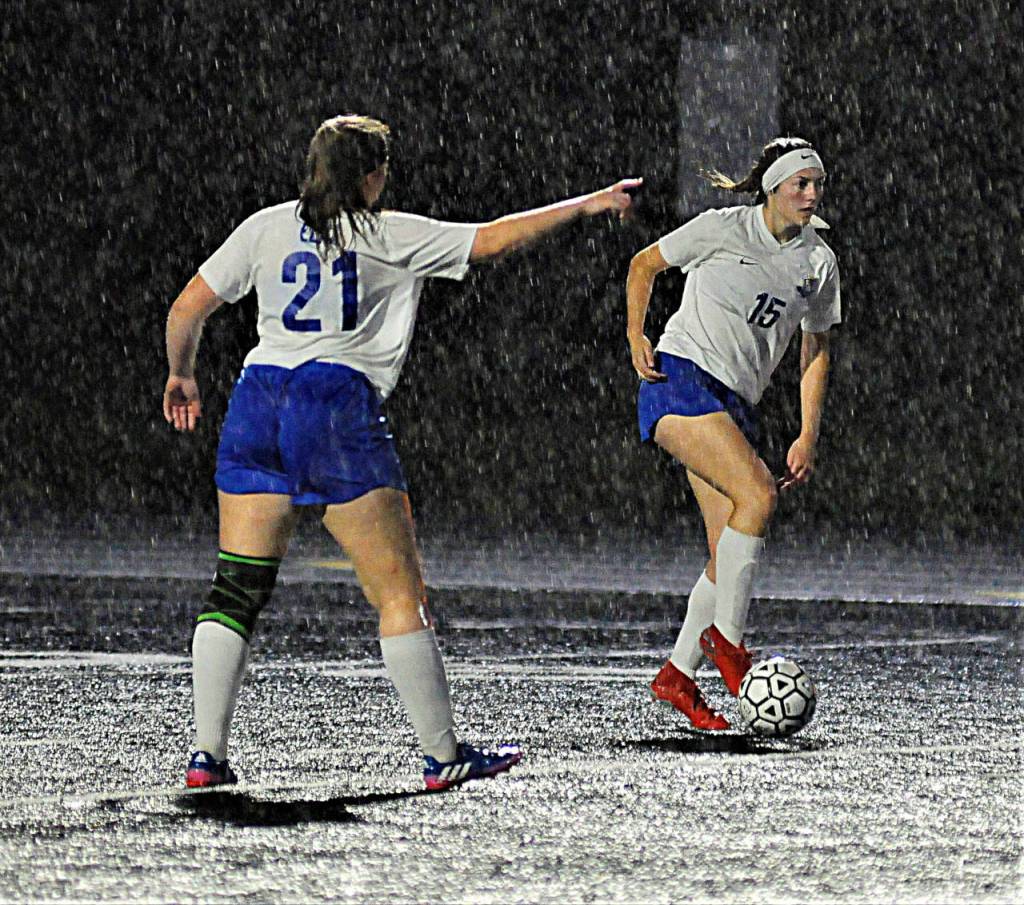 Elmas Autumn Kearse, right, dribbles the ball up field while Mercy Spencer directs her toward open space in the first half of a road match against Tenino on Thursday. (Hasani Grayson | Grays Harbor News Group)
