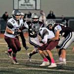 Montesano defensive lineman Tanner Nicklas (52) sacks Hoquiam quarterback Dane McMillan during the first half of the Bulldogs 48-0 victory on Friday at Jack Rottle Field in Montesano. (Hasani Grayson | Grays Harbor News Group)