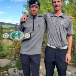 Tyler Cassell, left, stands with Travis Bossio while holding the championship belt after winning an event at The Suncadia Resort on Oct. 12. (Submitted photo)