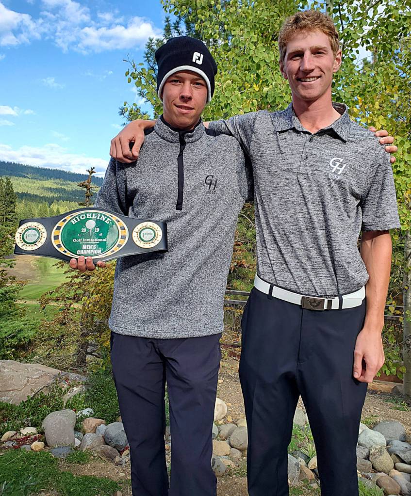 Tyler Cassell, left, stands with Travis Bossio while holding the championship belt after winning an event at The Suncadia Resort on Oct. 12. (Submitted photo)