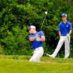Grays Harbors Dylan Christoffer practices a bunker shot on the 18th hole at Highland Golf Course while Tim Nail and Cooper Benfield look on during a practice session on June 4. (Hasani Grayson | Grays Harbor News Group)