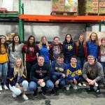 Courtesy photo                                This years Food Ball chairs and other volunteers from Aberdeen and Hoquiam high schools smile for the camera at Coastal Harvest on Monday. Two weeks of food collections and fundraising will begin Nov. 1.