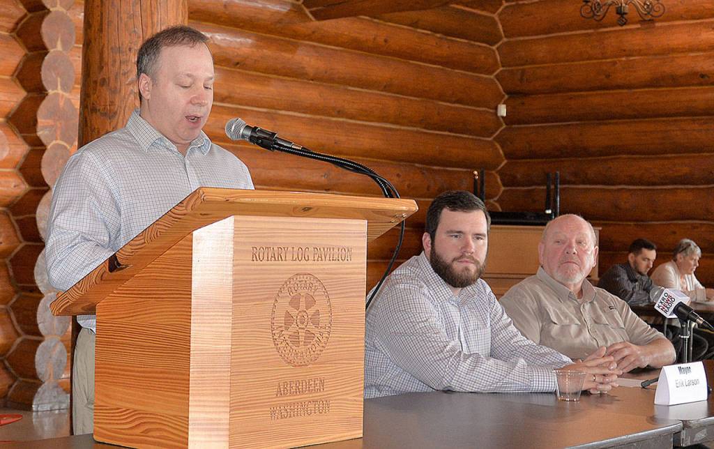 DAN HAMMOCK | GRAYS HARBOR NEWS GROUP                                Greater Grays Harbor Inc. CEO Dru Garson, at podium, speaks before the Greater Grays Harbor and Alpha Media Grays Harbor mayoral candidate forum Tuesday. At right are Aberdeen Mayor Erik Larson and his challenger, Councilman Pete Schave.