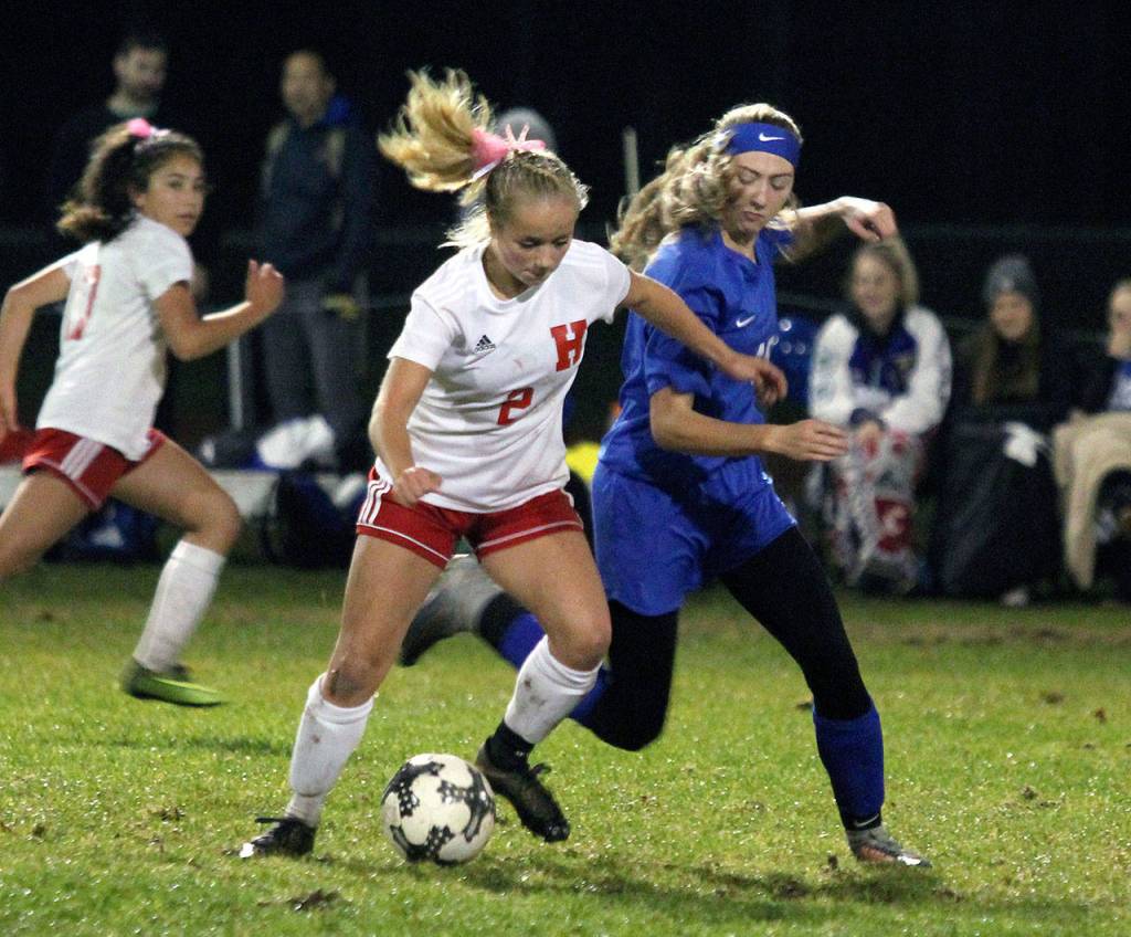 Hoquiams Sadie Carlyle, left, battles for possession with Elmas Jillian Bieker during the Grizzlies 3-0 win on Tuesday in Elma. Carlyle scored all three goals in the victory. (Submitted photo)