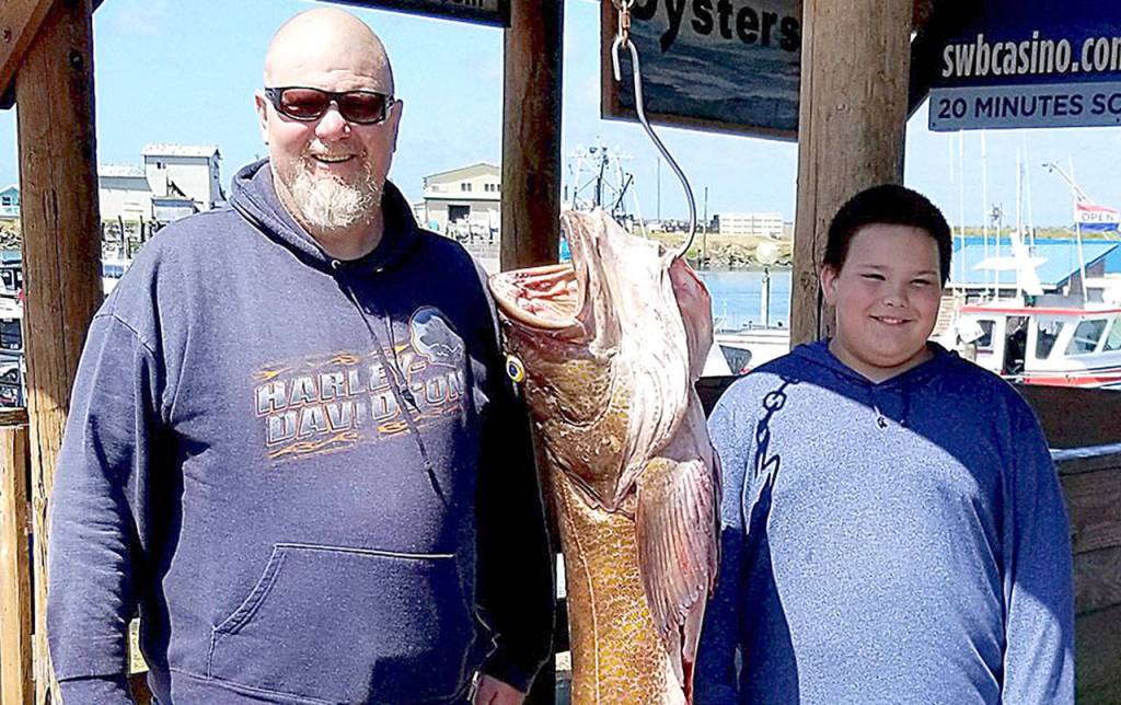 COURTESY WESTPORT WEIGHMASTER                                Todd Lakin of Sumner, left, pictured with grandson Roland, won the $1,500 prize for the largest lingcod weighed in during the Westport Charterboat Association derby this year with this 33.7-pounder.